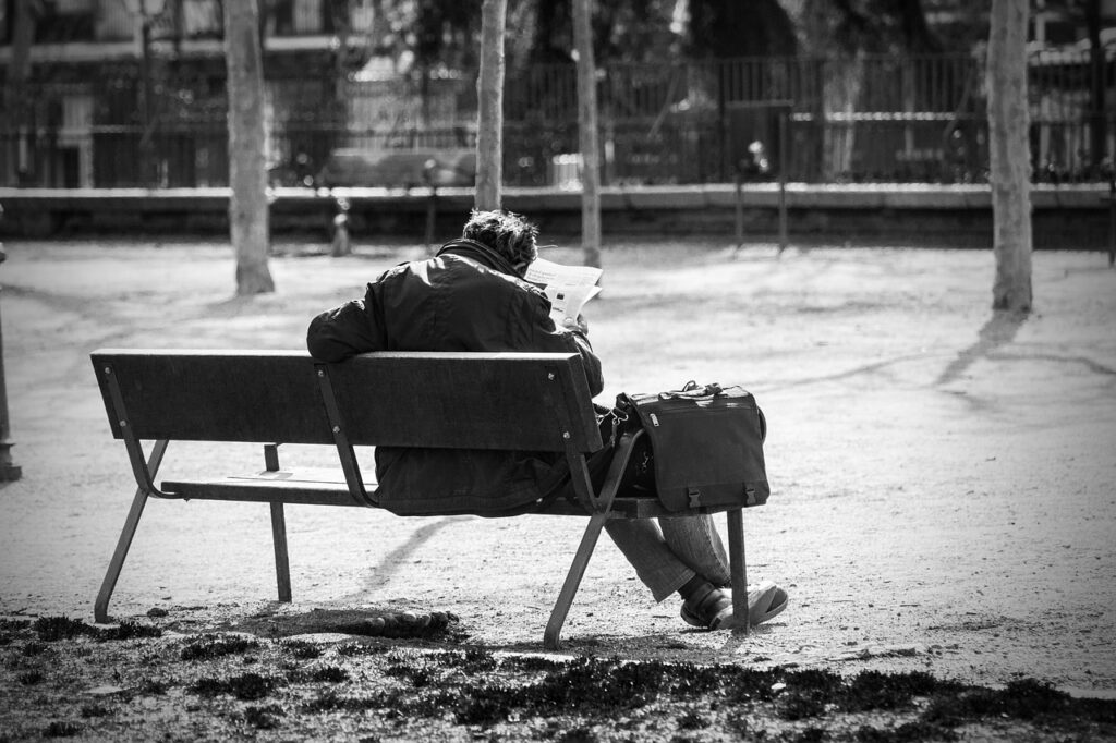 man on a bench 2069539 1280